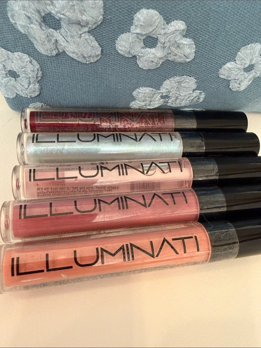 Blue Floral Cosmetic Pouch and FIVE Illuminati Lip Color
